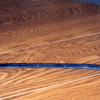 Cover lifter for wood stove